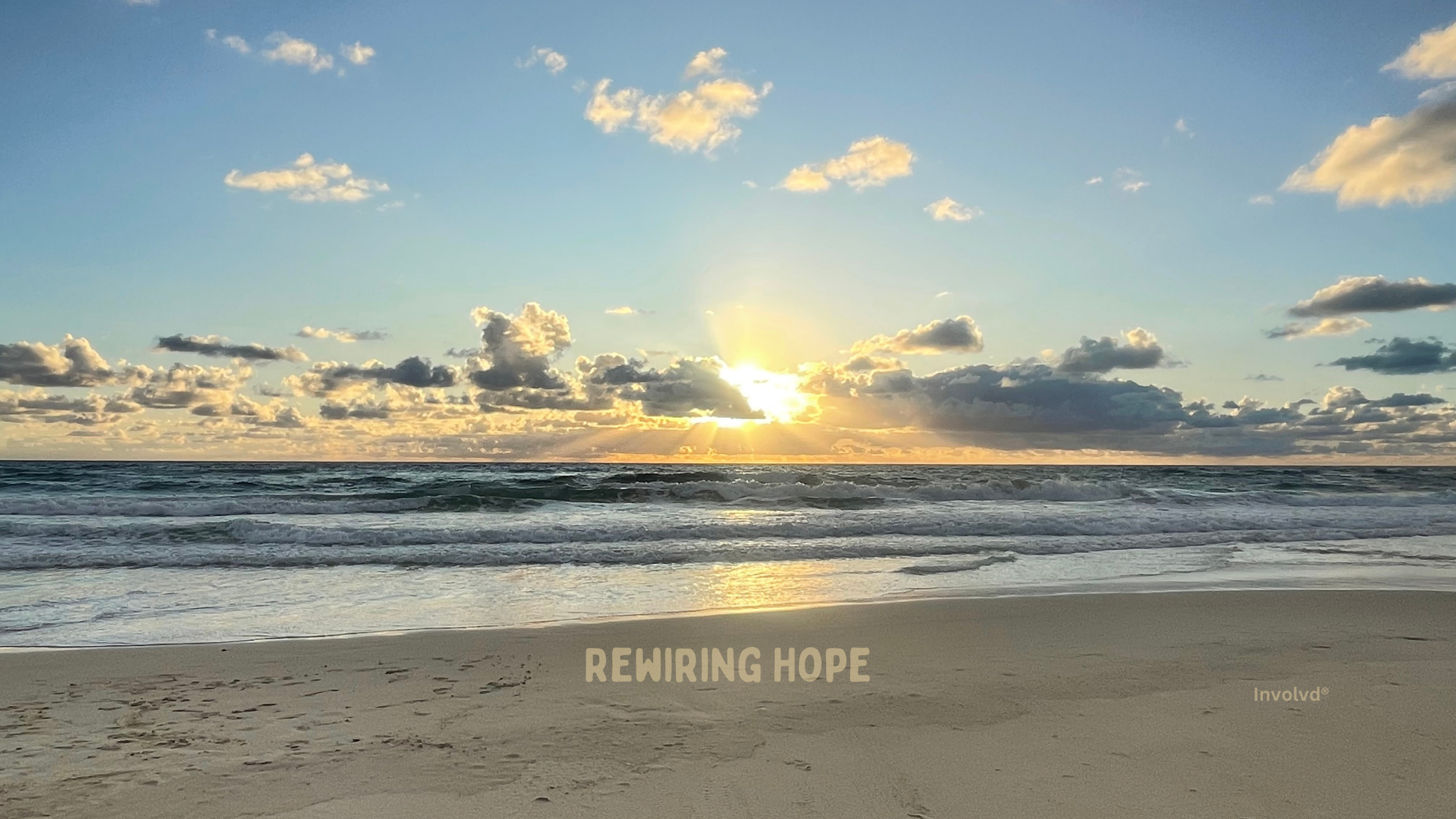 Calm ocean waves under a clear blue sky, symbolizing tranquility and hope.